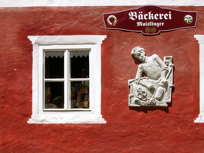  Since centuries multiple times plastered and painted wall - bakery in Hallstatt, Austria© Beate de Nijs